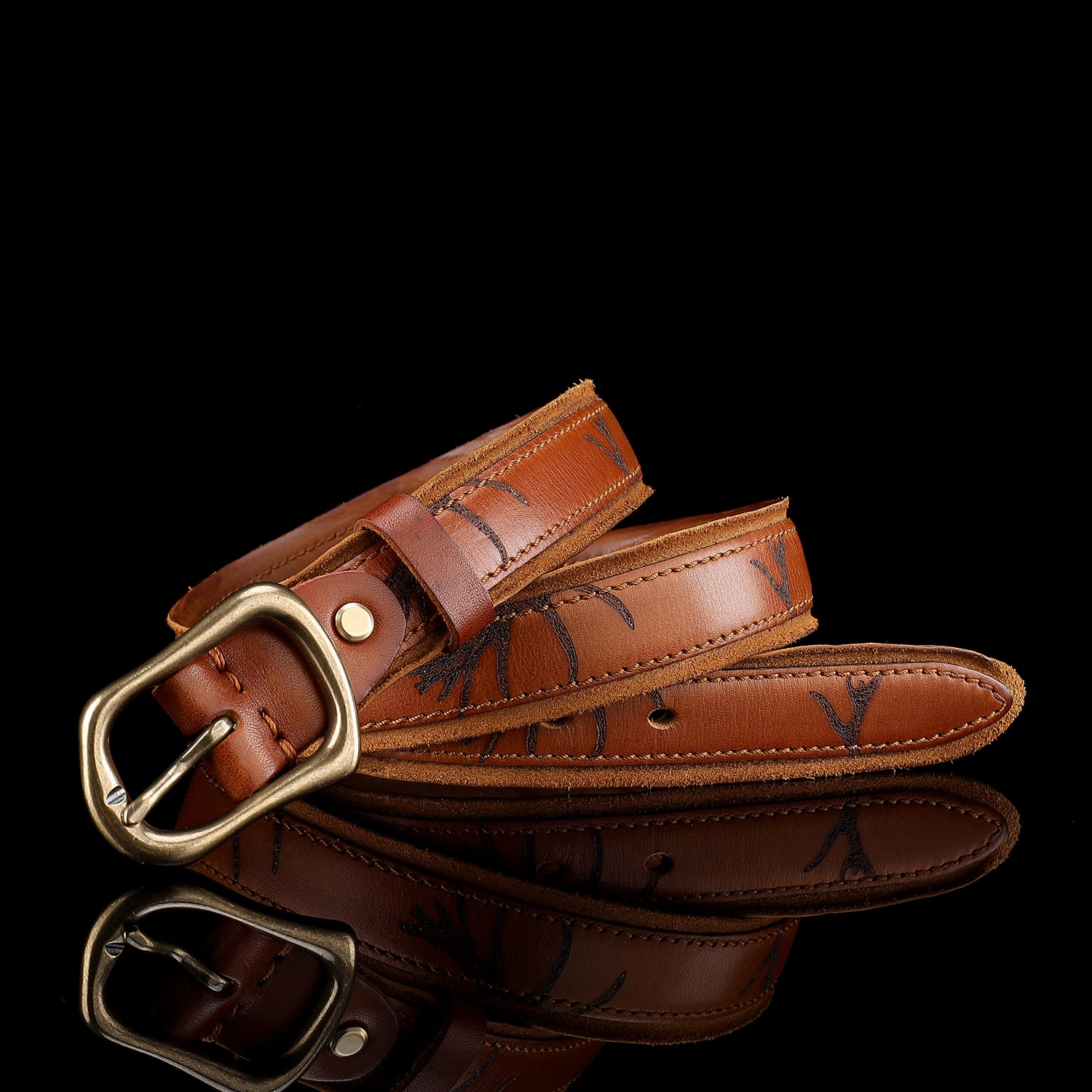 Artisan Stamped Leather Belt | Cognac Brown with Curved Brass Buckle — buckle close-up | BELTLEY