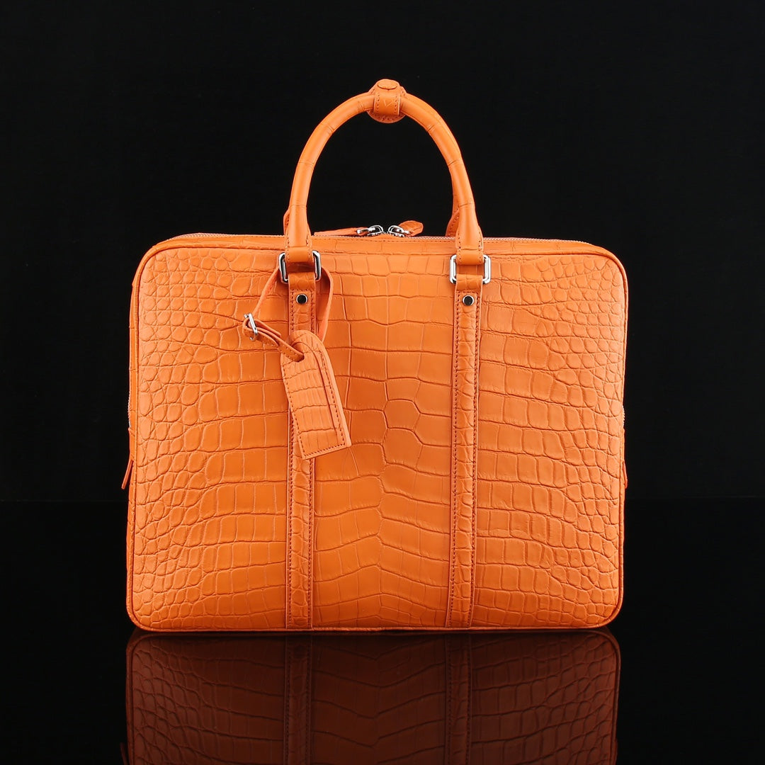 The BELTLEY Catalyst Briefcase in Vibrant Orange Crocodile