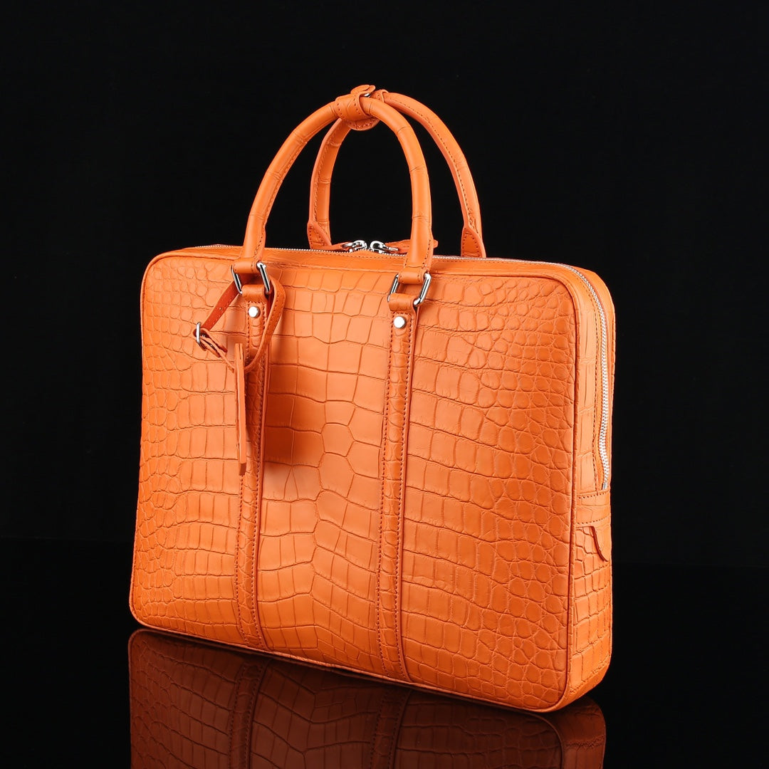 The BELTLEY Catalyst Briefcase in Vibrant Orange Crocodile
