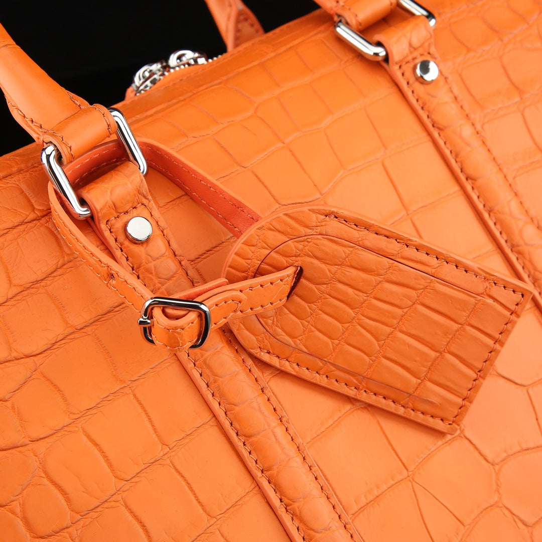 The BELTLEY Catalyst Briefcase in Vibrant Orange Crocodile