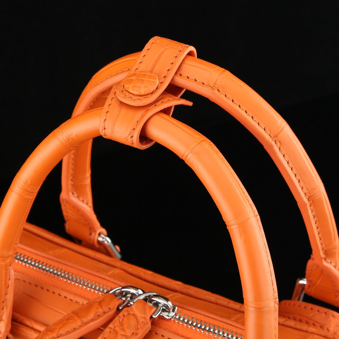 The BELTLEY Catalyst Briefcase in Vibrant Orange Crocodile